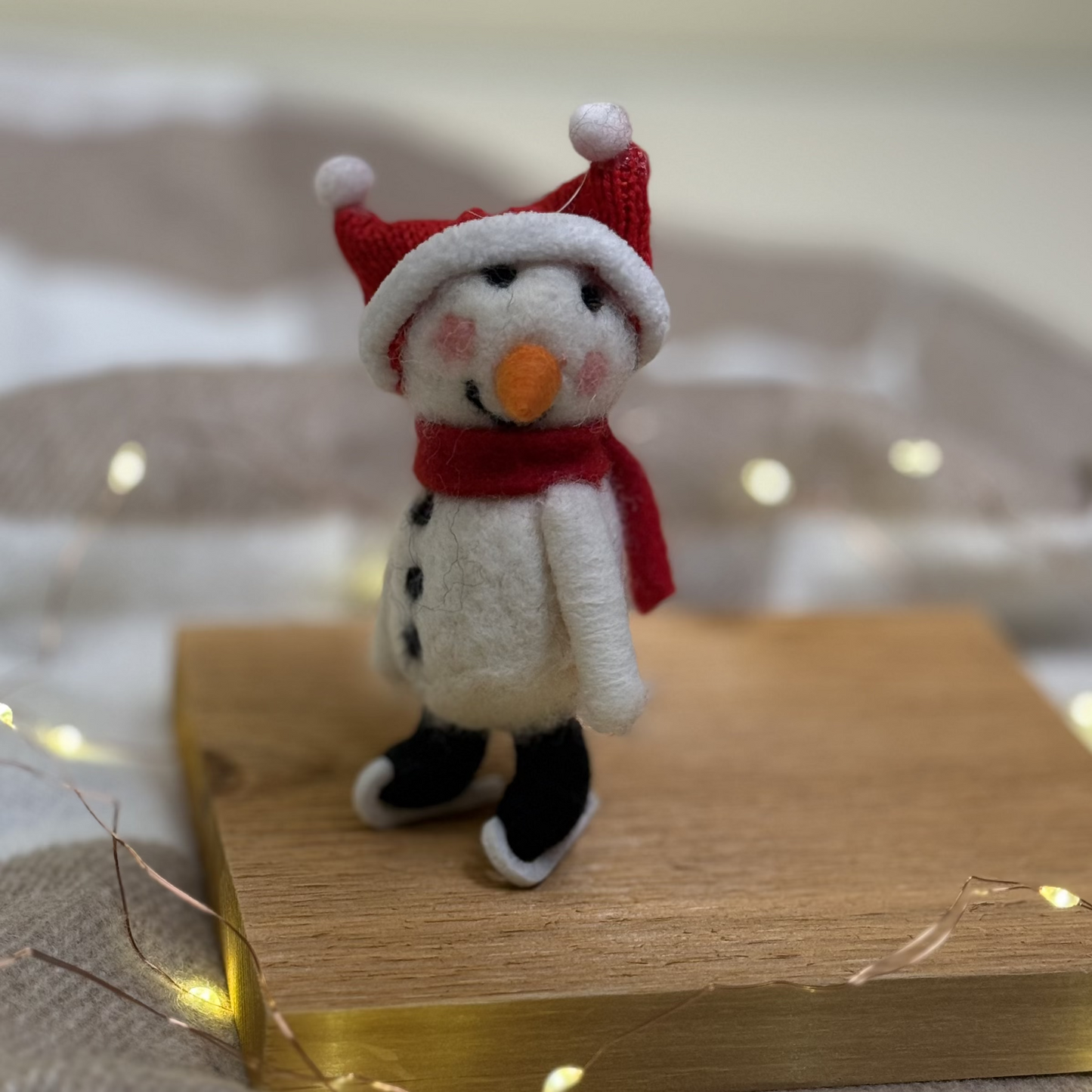 Felted Skating Snowman Ornament.